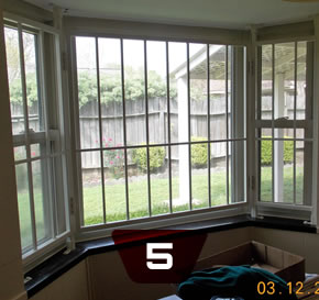 three-glass window with burglar bar